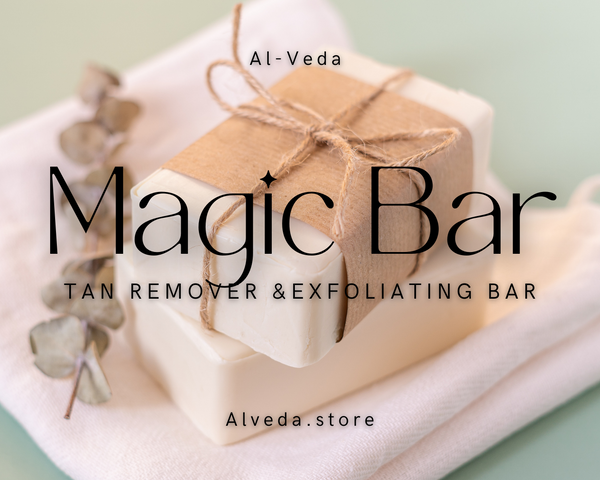 Tan remover & exfoliating bar with decorative paper on a light green background