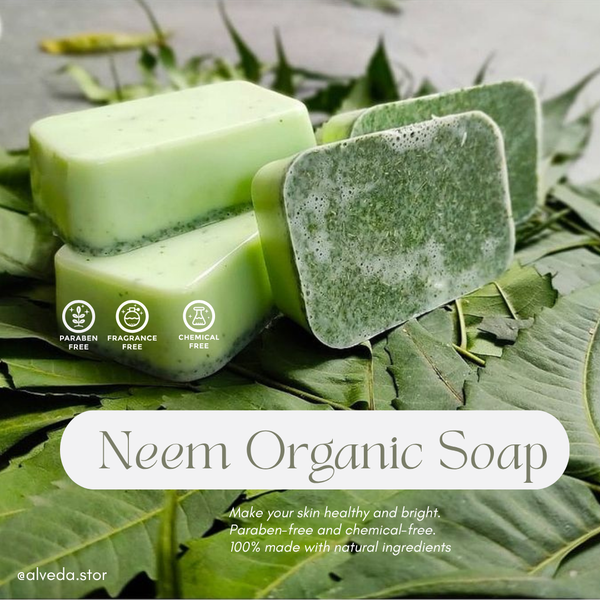 Neem organic soap bars on a leafy background with branding and product information.